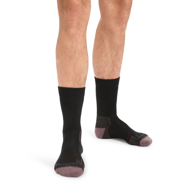 Side view of men's merino wool crew socks for hiking, showcasing the ankle support design.