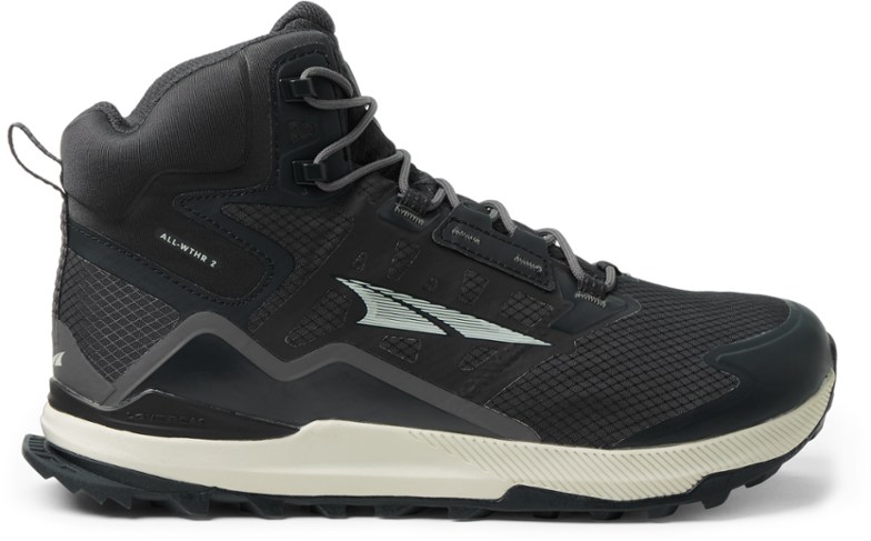 Side view of Altra ALL-WTHR Mid 2 hiking boots on rocky terrain.