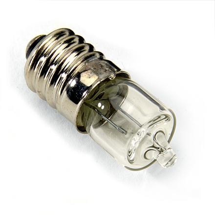 Petzl halogen bulb installed in a headlamp, showing bright light output.