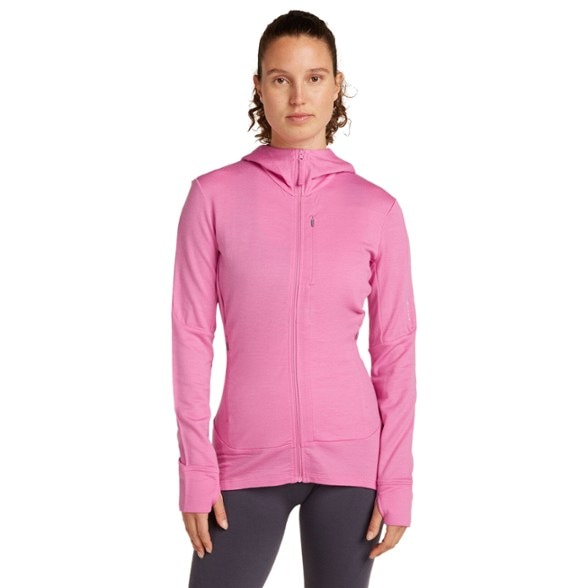 Side view of the women's merino wool zip hoodie, showcasing its fit and design during a hike.