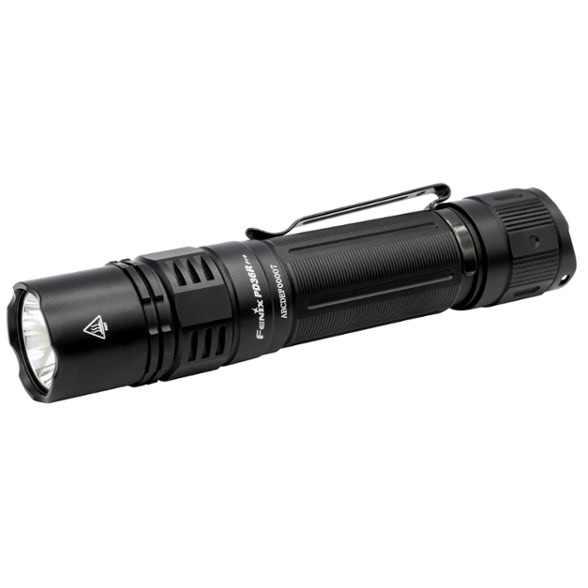 Fenix PD36R PRO tactical flashlight in use during a camping trip.