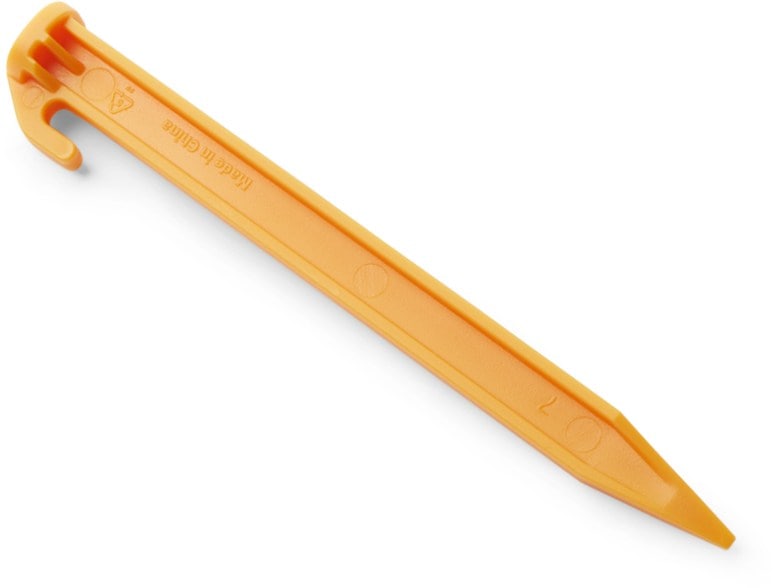 Close-up of Coghlan's 6-Inch tent pegs showcasing the wide-flanged base for loose soil stability.