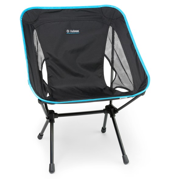 Helinox Chair One (re) set up at a campsite, showcasing its sturdy frame and lightweight design.