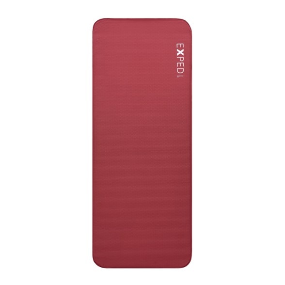 Exped MegaMat Max sleeping pad set up at a campsite, showcasing its luxurious thickness and design.
