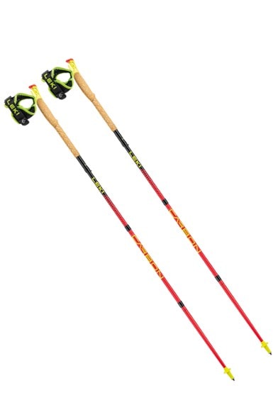 Leki Ultratrail FX.One trekking poles held by a runner on a scenic trail.
