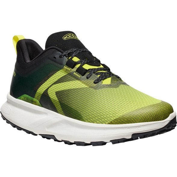 Side view of KEEN 450 Dirt men's waterproof hiking boots on rocky terrain.