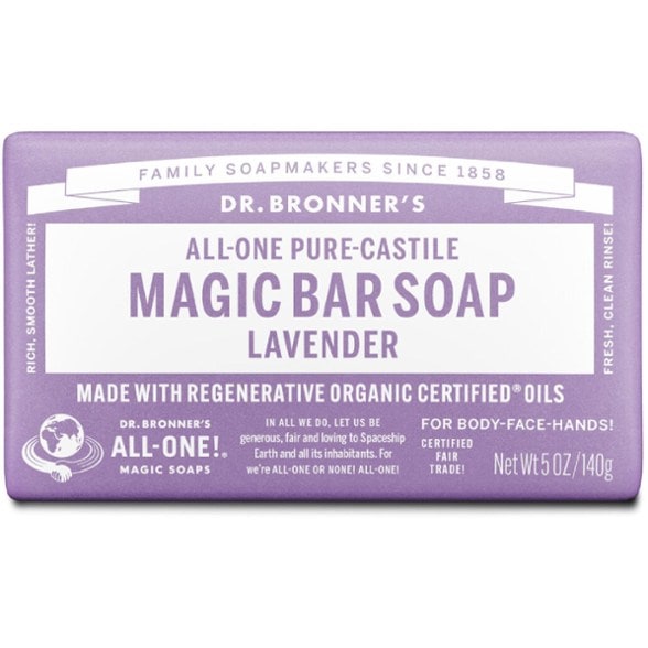 Eco-friendly castile soap bar on a camping table under the stars.