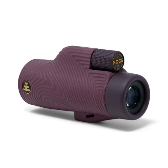 Close-up of Nocs Provisions 10x32 monocular showcasing the rugged Wave grip and oversize focus wheel.