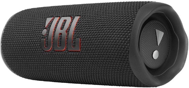JBL Flip 6 speaker on a beach towel, showcasing its waterproof design.