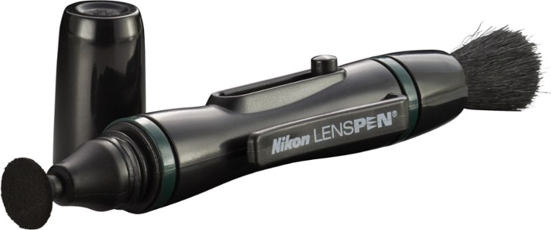 Close-up of Nikon Lens Cleaning Pen Pro showing retractable brush and cleaning tip.