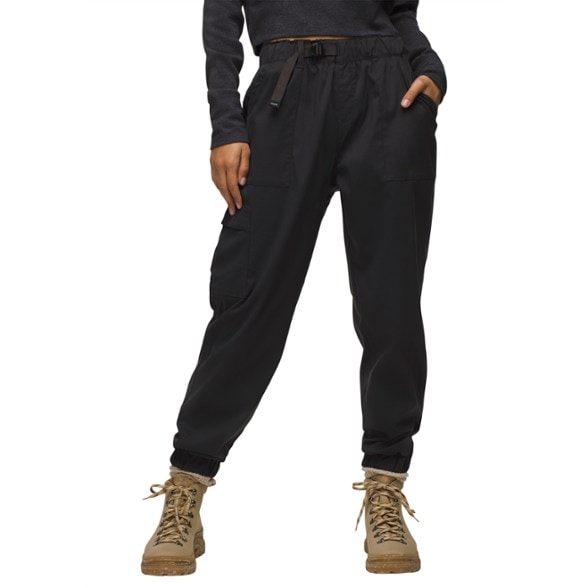 Women's high rise stretch joggers in action during a summer hike, showcasing their relaxed fit and moisture-wicking fabric.