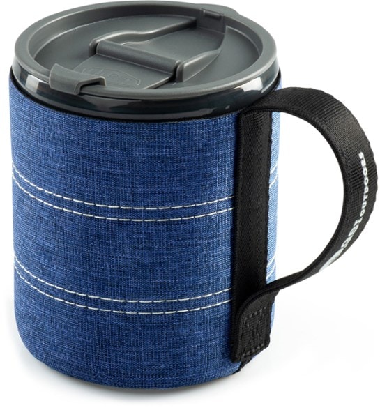 Adventure Insulated Backpacker Mug with lid shown in a camping setting