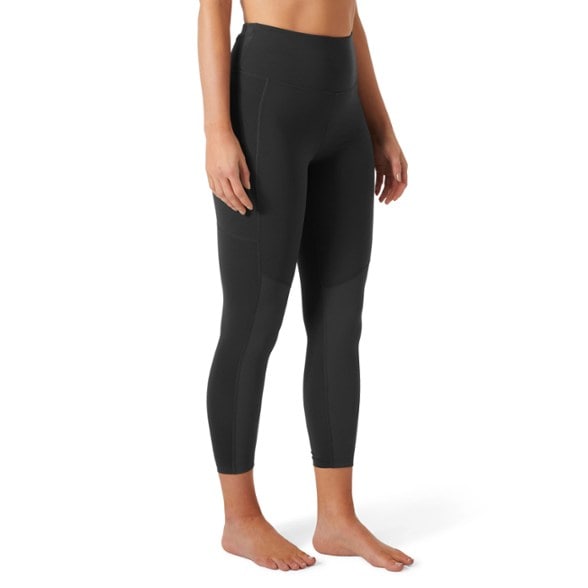 Side view of women's outdoor leggings with flexible fabric ideal for hiking