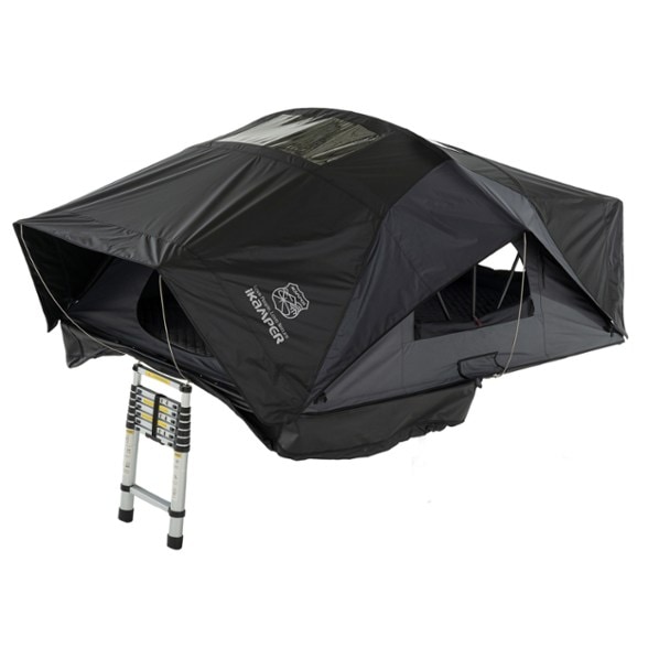 X-Cover 3.0 roof-top tent setup at a scenic campsite, showcasing its spacious interior and windows for natural light.