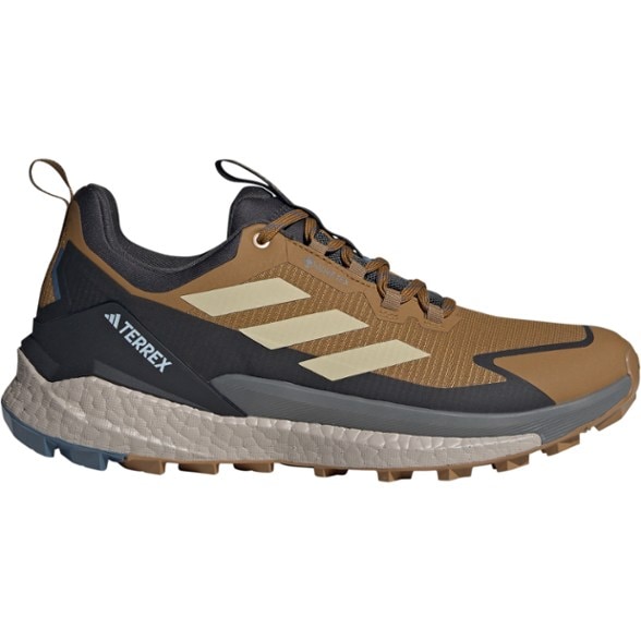 Profile view of Adidas Terrex Free Hiker GORE-TEX Low Hiking Shoes for Men on rocky terrain.