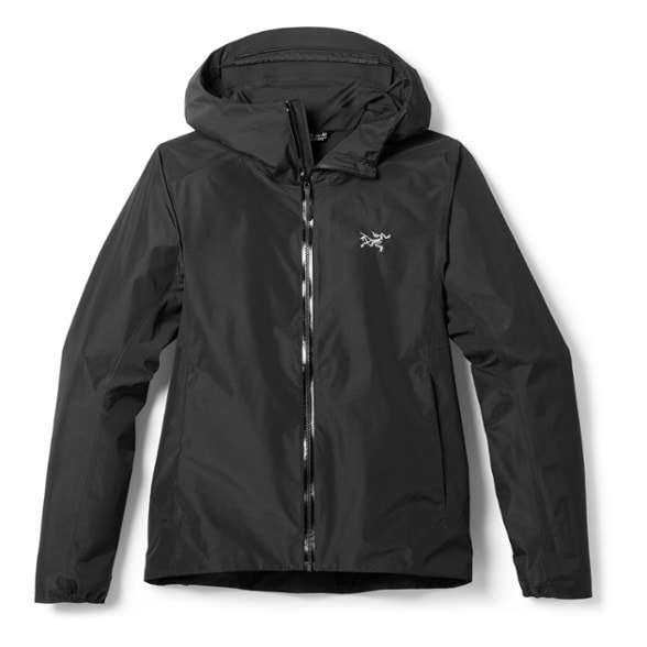 Front view of StormStride women's hiking jacket shown in glacier blue with hood up against strong wind