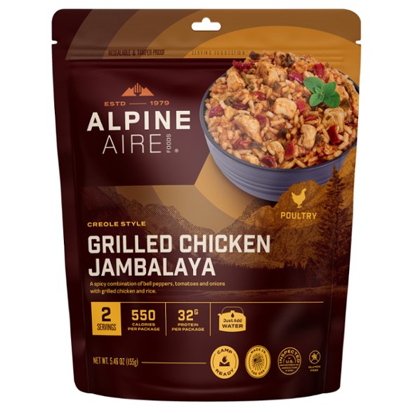 Spicy Chicken Jambalaya meal preparation outdoors, showcasing vibrant ingredients.