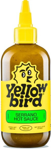 Top-down photo of Yellowbird Explorer Pack hot sauce bottles arranged for camping use