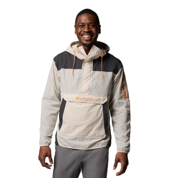 Columbia Challenger Anorak shown in a hiking trail, showcasing its wind-resistant features.