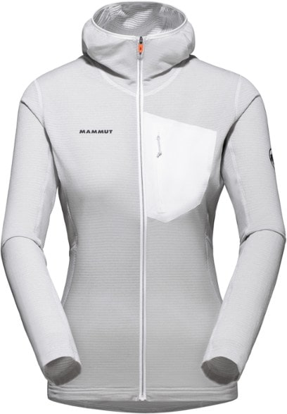 Mammut Aenergy Light Women's fleece jacket in action on a mountainous trail, showcasing its lightweight design.