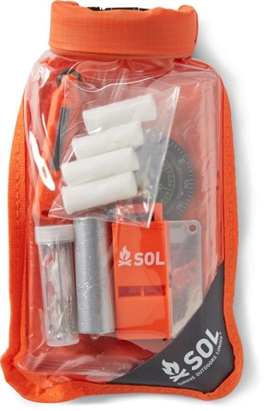 Ultimate Scout Survival Gear Kit displayed in a waterproof dry bag with all contents visible.