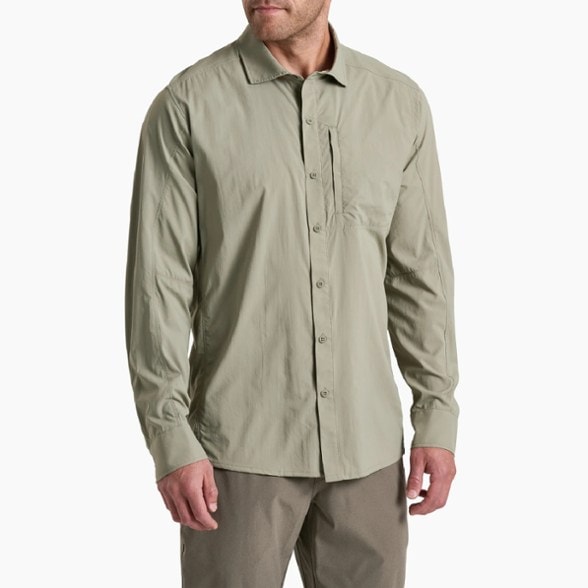 Kuhl men's long sleeve UV protection shirt displayed outdoors with mountains in the background.