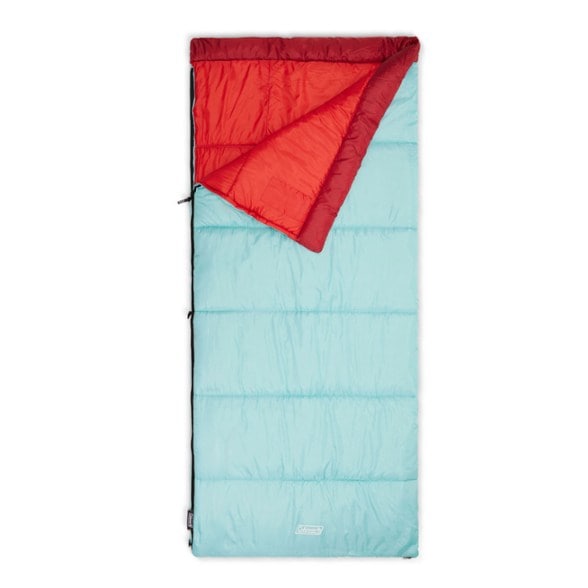 Top view of Coleman EcoTrail sleeping bag laid out at campsite, showing roomy rectangular shape