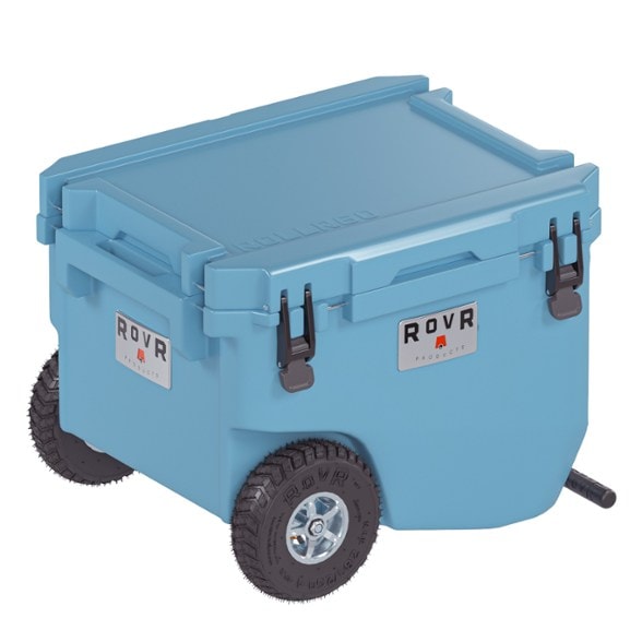 AdventurePro 60 wheeled cooler showcasing rugged wheels and bear-resistant features in an outdoor setting.