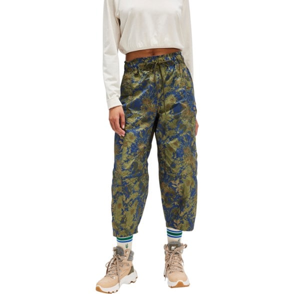 Front view of women's hiking pants showing relaxed fit and cargo pockets