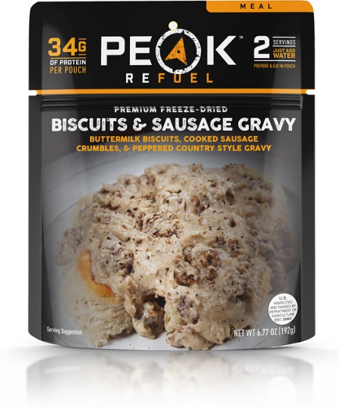 Top-down shot of prepared freeze-dried breakfast with sausage gravy and biscuits in a camping bowl