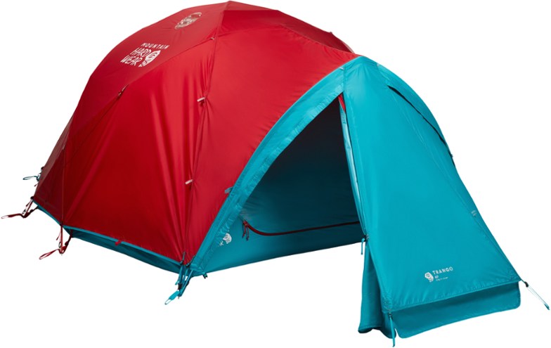 SummitGuard 4-Person Alpine Tent set up in a snowy alpine landscape, highlighting its waterproof design and sturdy structure.