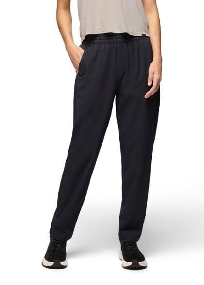 Front view of women's climbing pants showcasing their stretch fabric and elastic waistband.