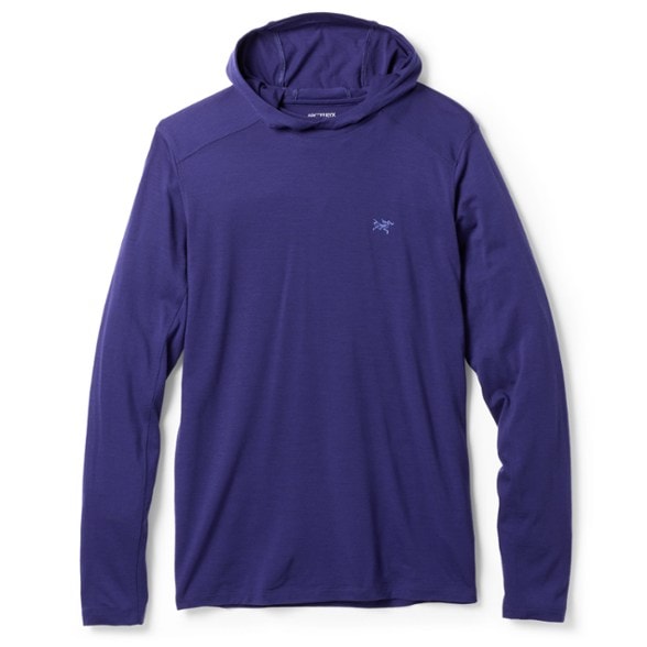 Ionia Merino Wool Hoody in action on a hiking trail, demonstrating its breathability and lightweight design.