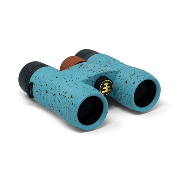 Nocs Provisions 8x32 binoculars showcasing their ergonomic design and oversized focus wheel.