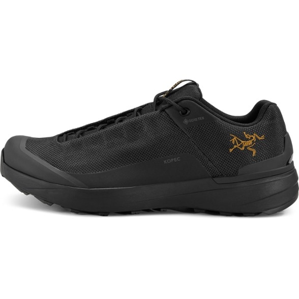 Side view of Arc'teryx Kopec GTX Men's Lightweight Hiking Shoes, highlighting the CORDURA mesh and TPU toe caps.