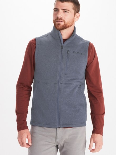 Front view of Marmot Trailblazer fleece vest for men, showcasing lightweight fabric and zippered pockets ideal for hiking gear.