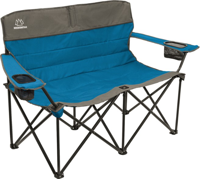 Side view of Mountain Summit Gear Quilted Camping Loveseat at a backyard event.