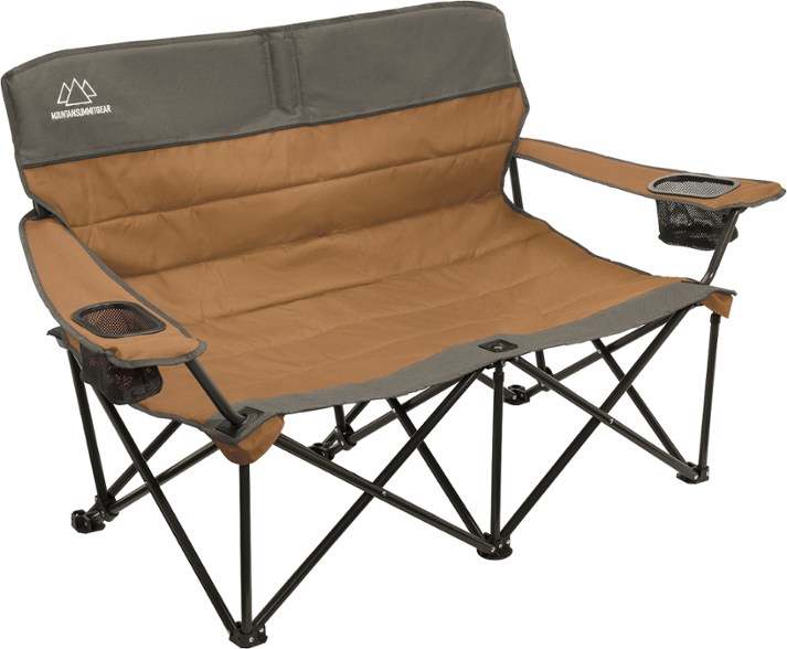 Cozy Quilted Loveseat set up at a campsite with beautiful scenery in the background.