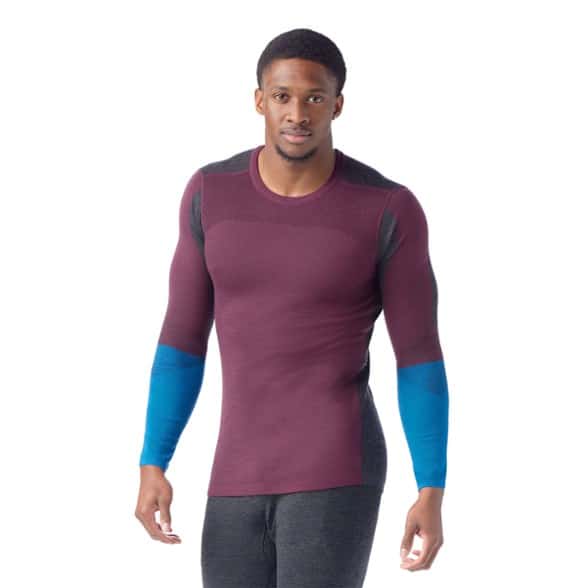 Men wearing performance merino wool base layer shirt during outdoor activities.