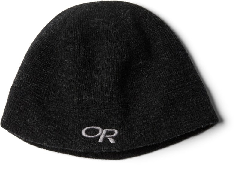 Thermal Trek Beanie in action during a snowy hike, highlighting its moisture-wicking fleece lining and warm wool blend.