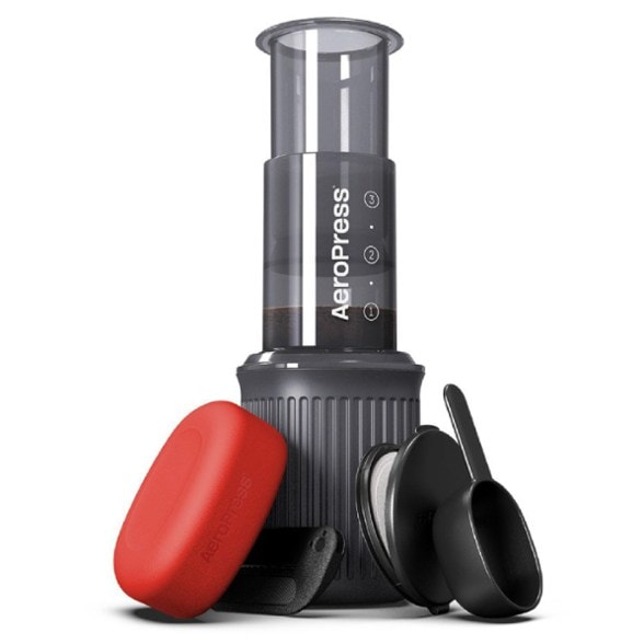 AeroPress Go Travel Coffee Press in a camping setting, showcasing its portability.