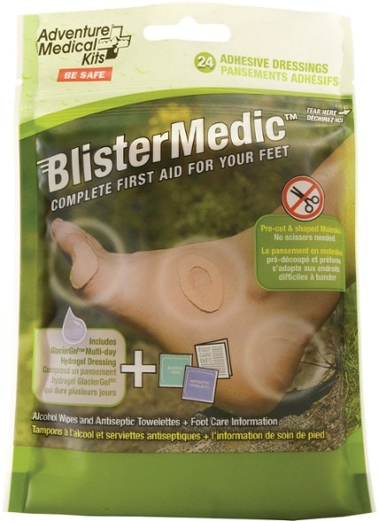 Close-up of blister kit with Moleskin pads and hydrogel dressings laid out on hiking gear