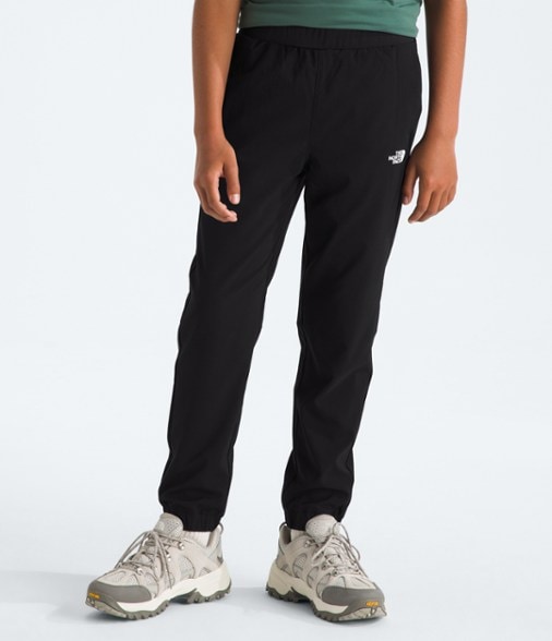 Boys wearing Eco-Friendly Adventure Pants while hiking in the woods, showcasing comfort and flexibility.