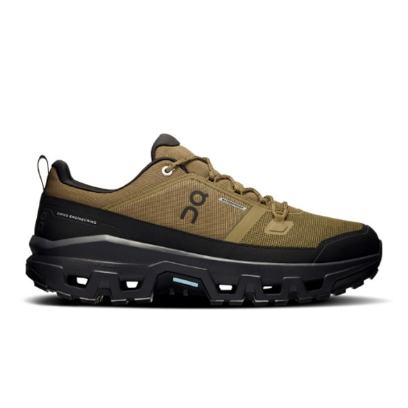 Side view of On Cloudrock Low Men's Waterproof Hiking Shoes highlighting the durable toe cap and waterproof material.