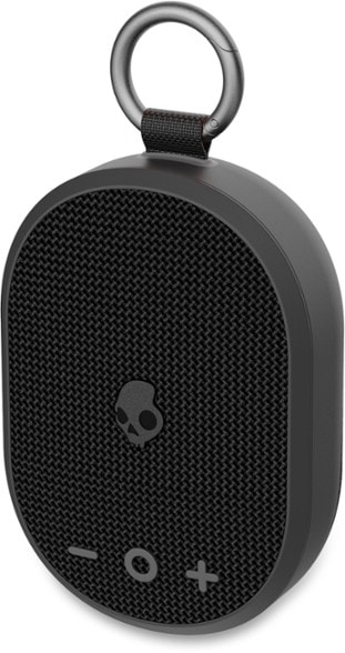 Skullcandy Kilo Bluetooth speaker in use at a campsite, showcasing its rugged design.