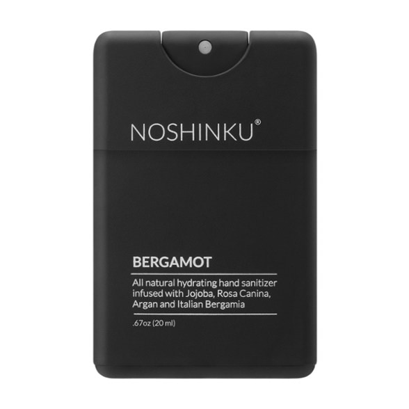 Eco-Friendly Moisturizing Travel Sanitizer in a camping setting, ready for adventure.