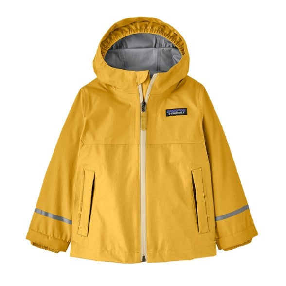 Toddler wearing the Explorers' waterproof jacket while jumping in puddles.