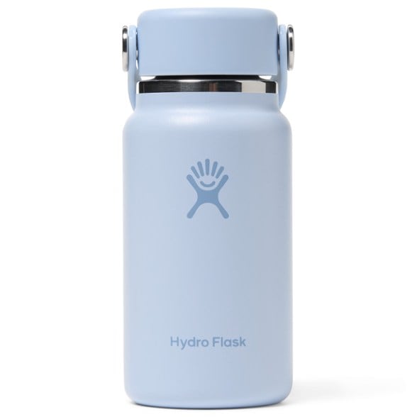 Compact travel water bottle in hand, showcasing its sleek design.