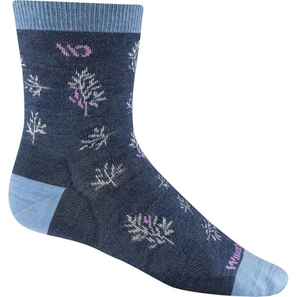 Side view of lightweight crew socks made with merino wool, showing stretch fit on women's calf
