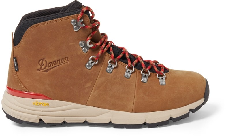 Danner Mountain 600 Leaf GTX hiking boots in rugged terrain, highlighting waterproof features.